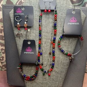 4 piece Paparazz Santa Fe fashion fix set. Multi colored beads, dragonfly’s.